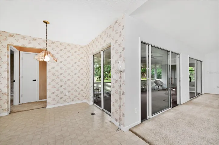 Family room next to kitchen that has sliders to the lanai