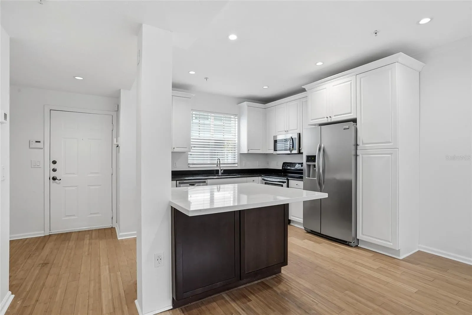 Kitchen and the door leads to the pool and Hyde Park Village