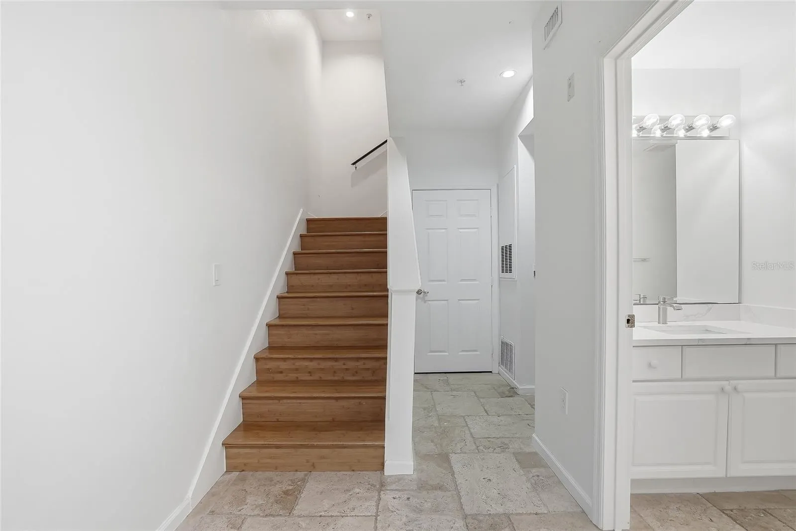 Stairs to the 2nd floor and full size bathroom downstairs