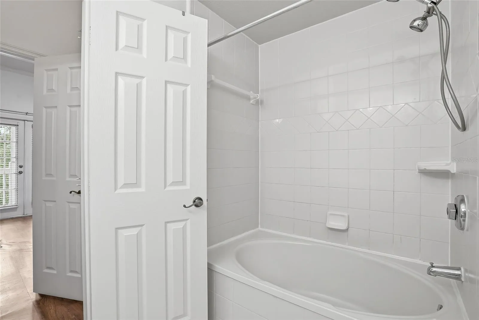 primary bathroom with a soaker tub