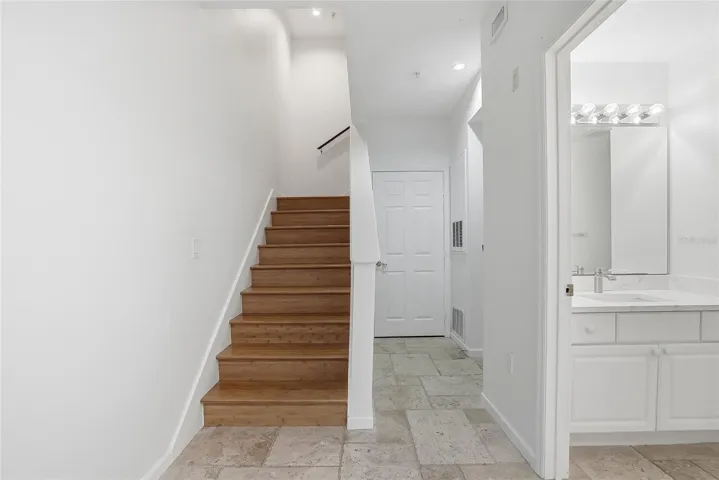 Stairs to the 2nd floor and full size bathroom downstairs