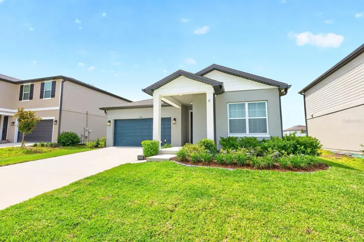BUILT IN 2023 and meticulously maintained, this 3-bedroom, 2-bathroom home in Deltona's desirable Hampton Oaks community offers modern finishes, an OPEN CONCEPT layout, and peaceful views with no rear neighbors!
