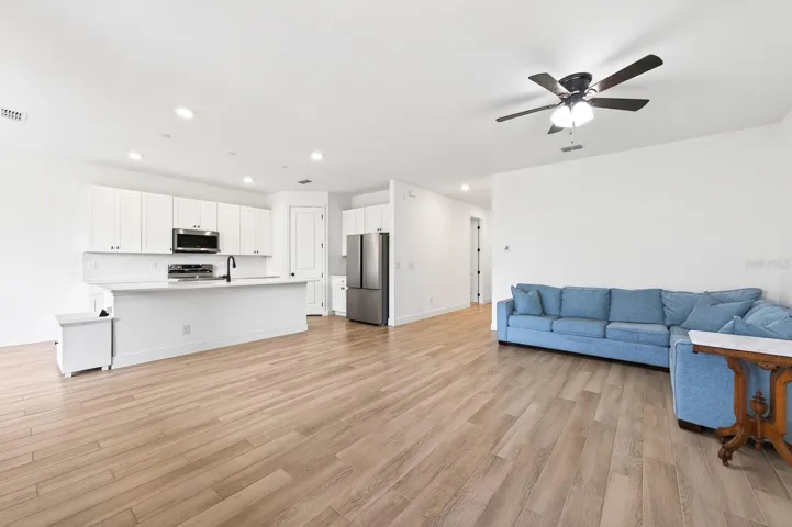 Kitchen is open to the living and dining areas.