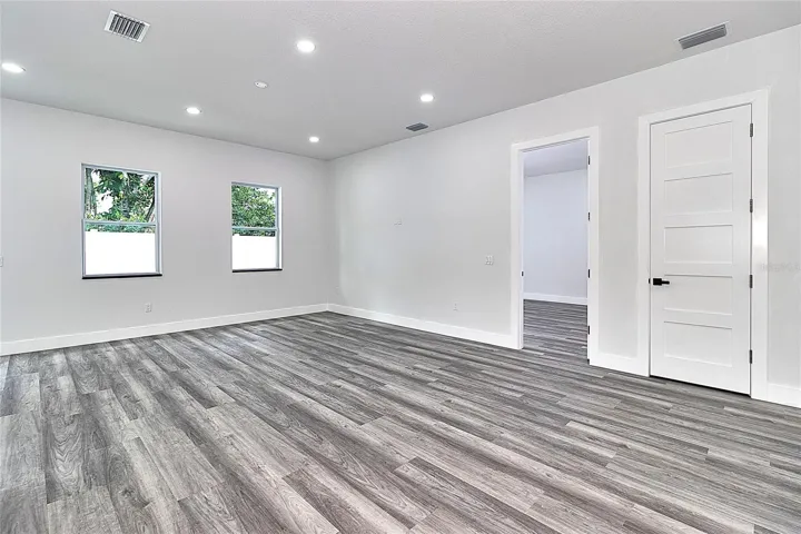 Great Room with Primary Bedroom thru open door