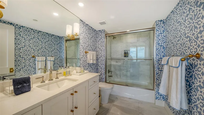 Exquisite finishes as well as top of the line fixtures are complimented by luxury linens, towels and wall treatments