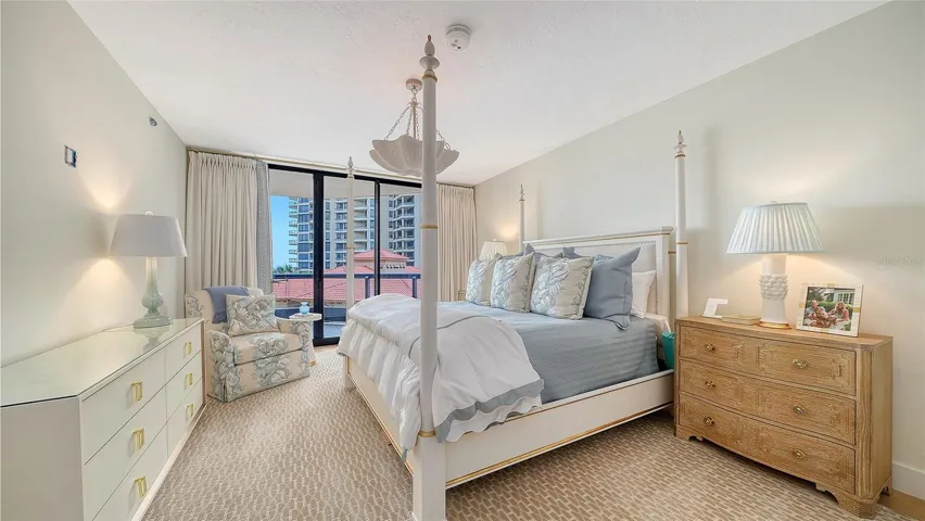 The primary bedroom exudes sophistication and tranquility with your own private terrace for the beach to lull you to sleep at night...