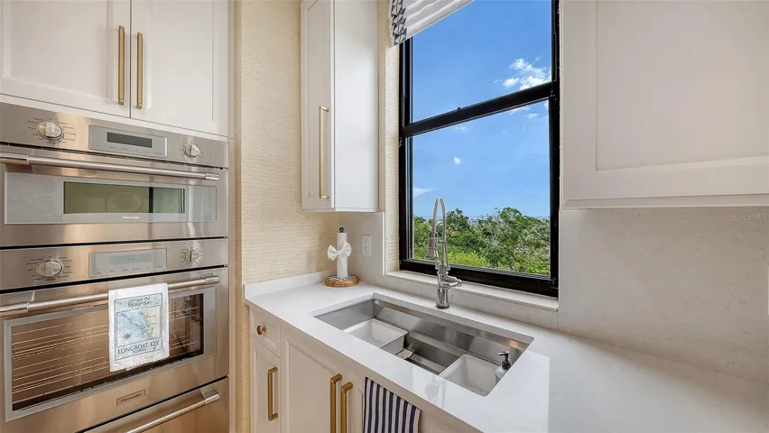 Top of the line cabinetry with great storage and pullouts w/ Sarasota Bay  vistas all day