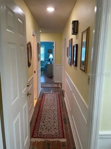 Brick Hallway to bedrooms