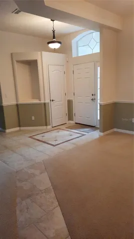 Entry foyer with walkway to the kitchen