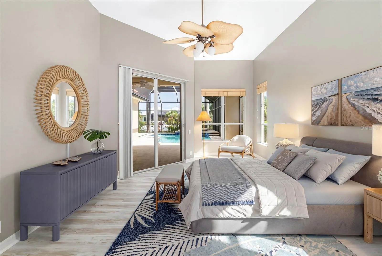 Primary, bedroom, sitting area, private access to lanai with water view overlooking the pool/spa.