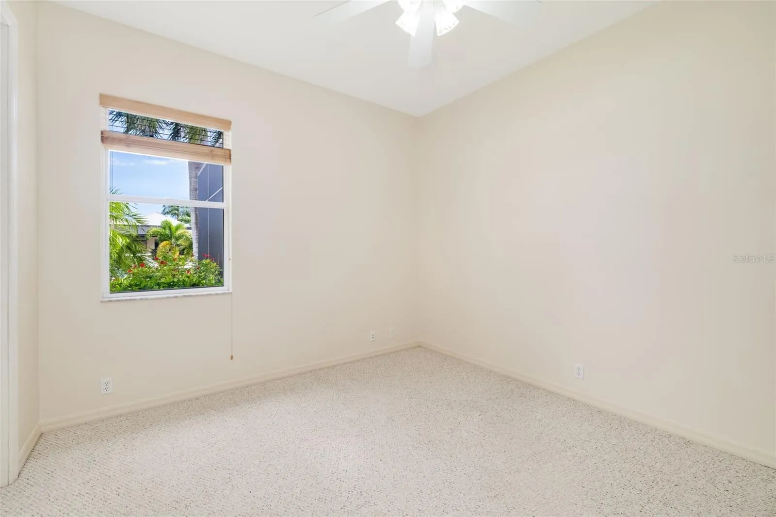Bedroom two with large closet view of the Freshwater canal, towards the back of the home