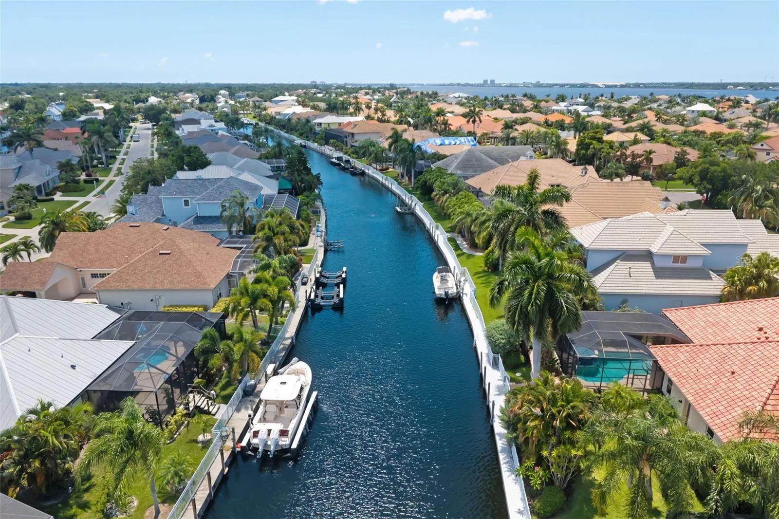 Backyard canal with boat dock, The Inlets behind the gates of Harbour Walk.