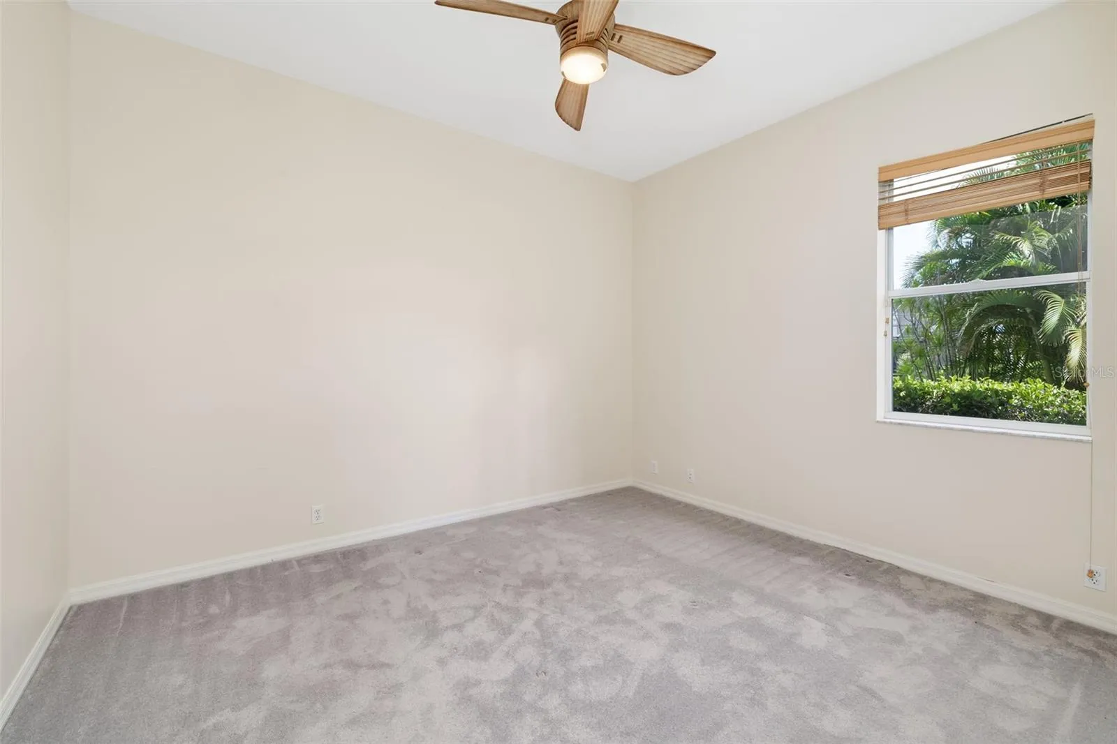 Bedroom 3 with large closet and view of the backyard and boat dock