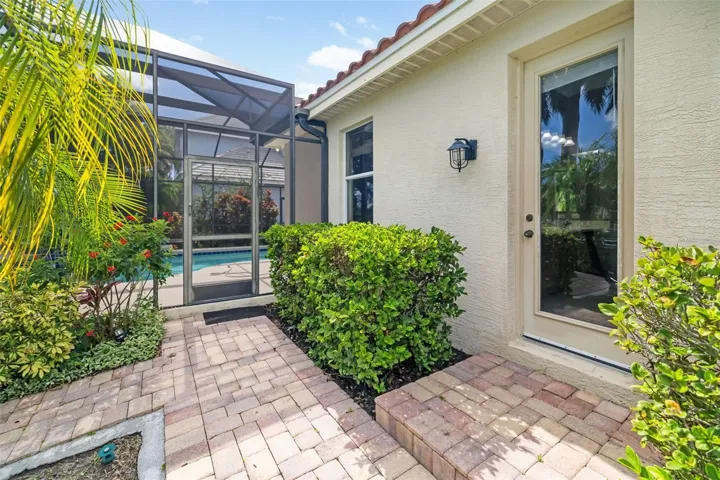 Bathroom two door leading out to the backyard, pool, lanai, boat dock and Freshwater canal