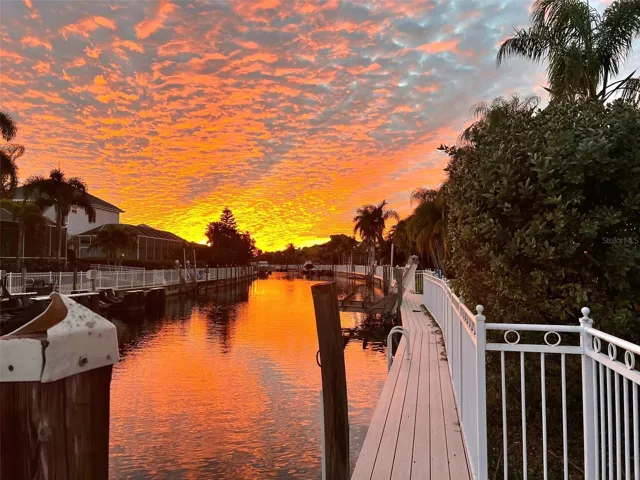 4770 Mainsail Drive Picturesque Florida sunset backyard off the boat dock