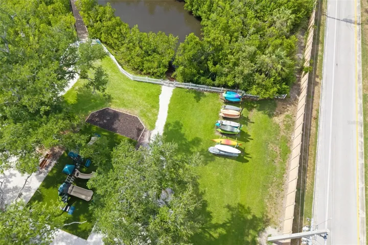 Enjoy nature with mature, lush tropical Palms, community kayak launch, walking bridge that winds around the community at Harbour Walk