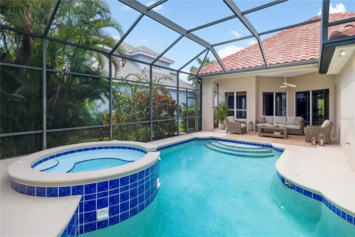 Pool/spa with large covered area for enjoying the Florida majestic sunsets