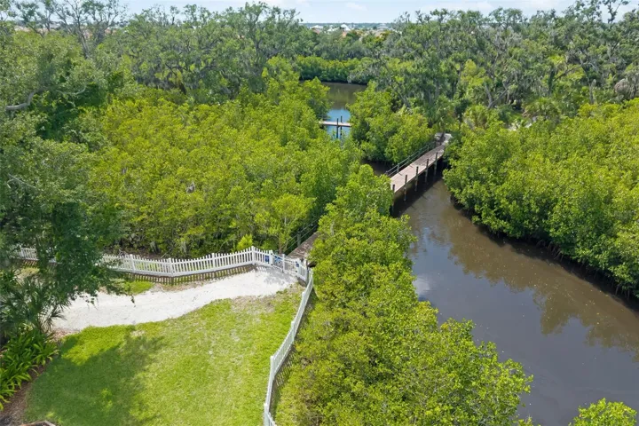 Community fishing dock, bridge with walking, hiking trails winding throughout the community
