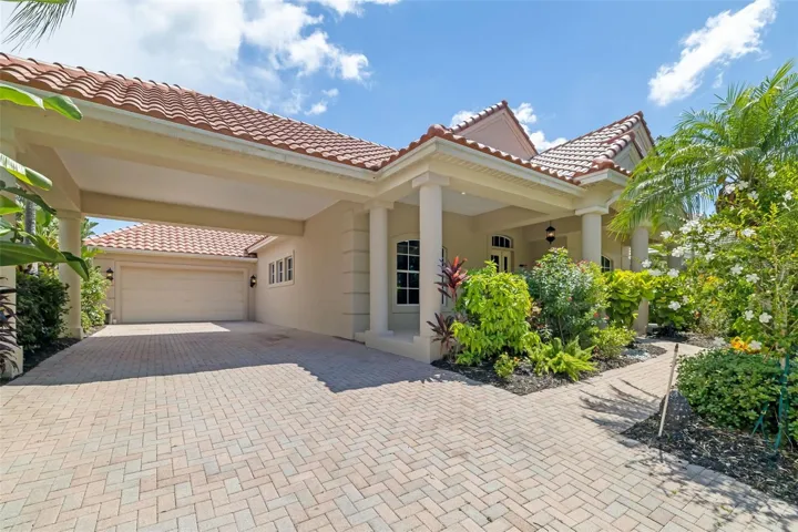 4770 Mainsail Drive, Bradenton, FL 34212 large covered paver driveway, Portico, walkway leading up to the oversized front porch entryway