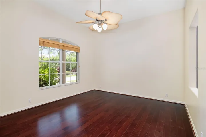French doors leading to the Den/office with access to half bath.