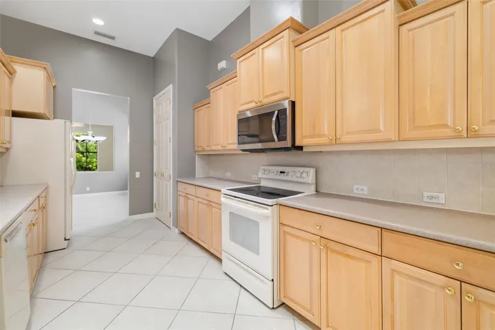 Spacious kitchen with plenty of storage cabinetry, large pantry
