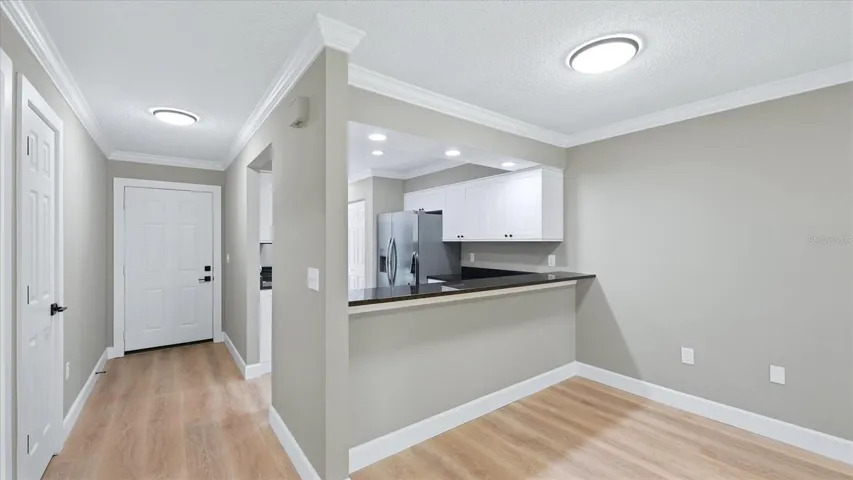 Dining Room looking into kitchen and front entry