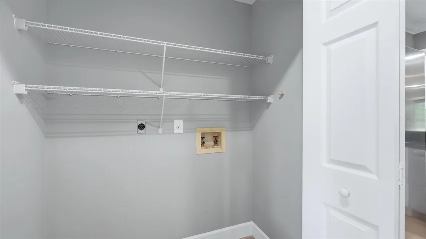 washer & dryer hookups in kitchen closet