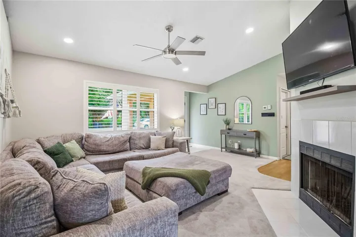 Living Room Facing Front Door, Plantation shutters, fireplace