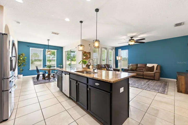 Kitchen is open to the living and dining areas.
