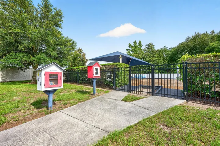 Stop at the little library before heading into the community playground.