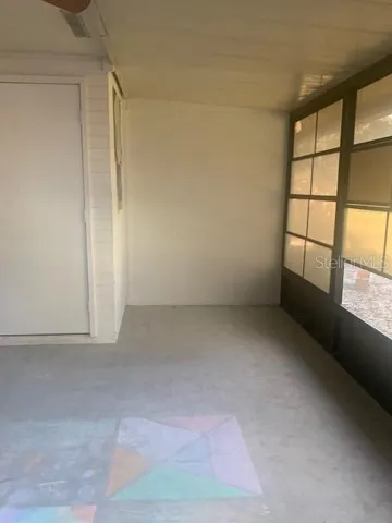 Screened rear patio/ exterior storage closet