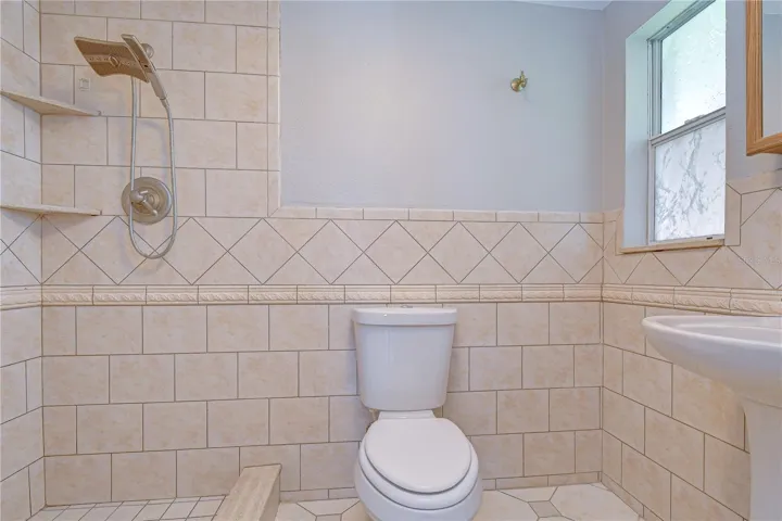 Renovated en-suite bathroom with updated finishes.