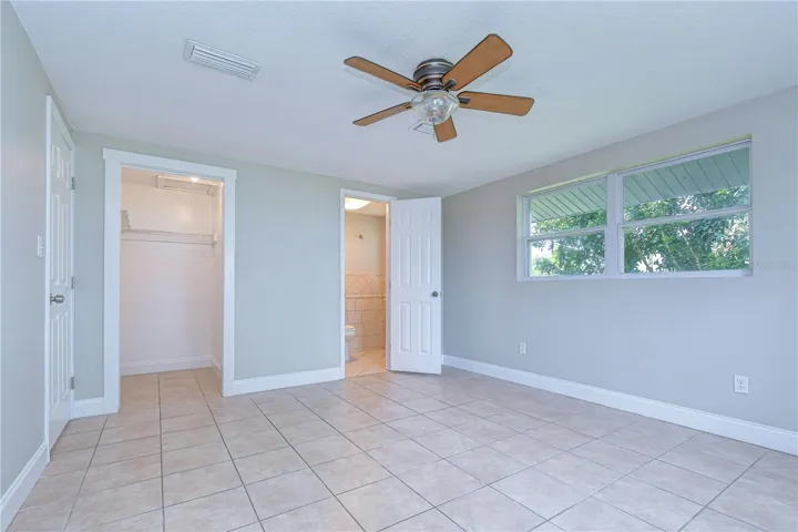 Comfortable and private primary suite with closet and bathroom.