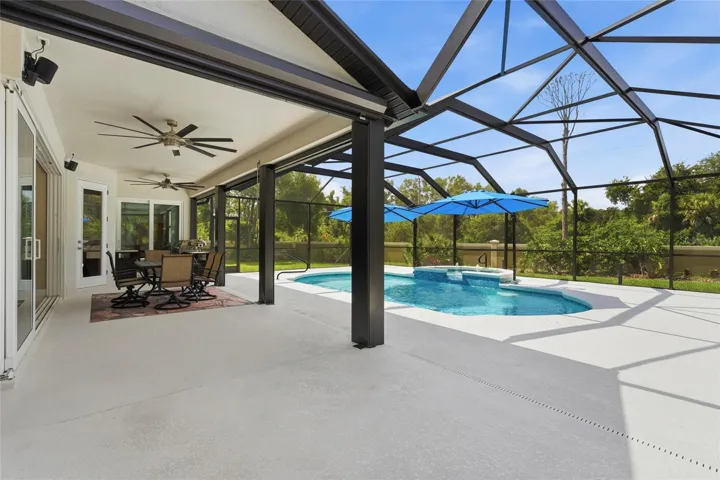 Expansive screened lanai and pool + spa area