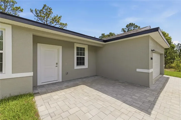 FRONT COVERED PAVER PORCH