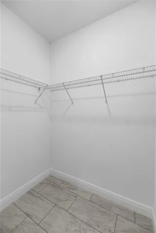 MASTER 1 OF 2 WALKIN CLOSETS