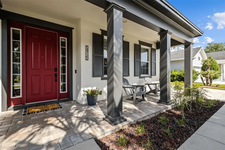 Pavered front porch with room for seating