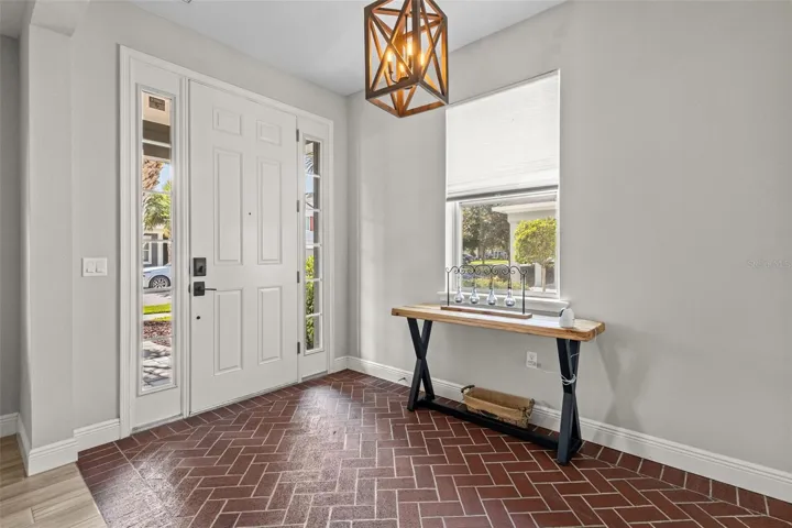 Distinctive brick-floor entry makes a standout first impression