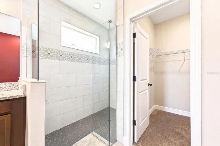 Primary en-suite bath separate shower.