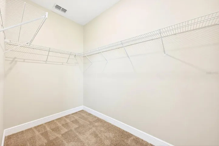 Primary suite - one of two walk-in closets.