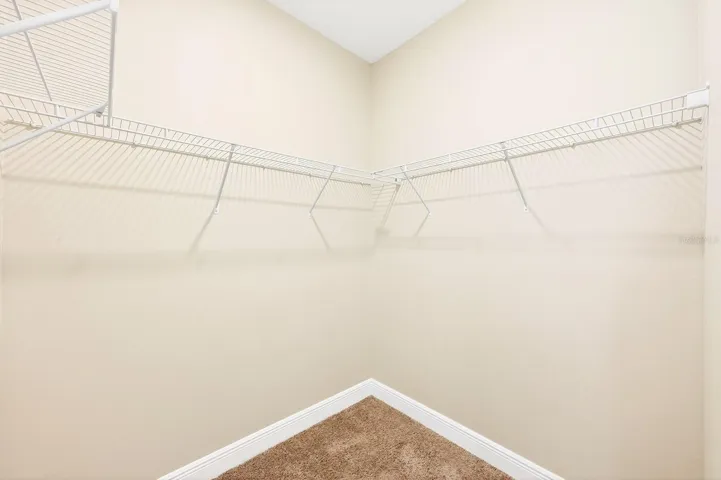 Primary suite - one of two walk-in closets.