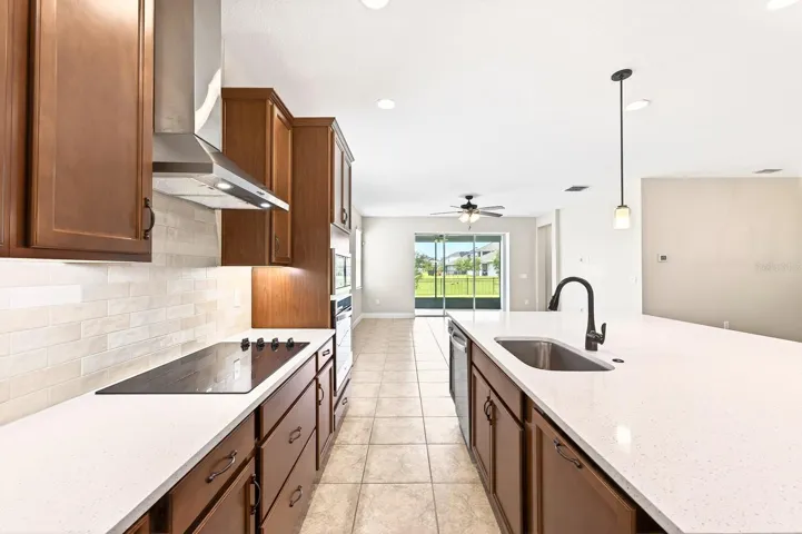 Seamless flow into the living and dining spaces.