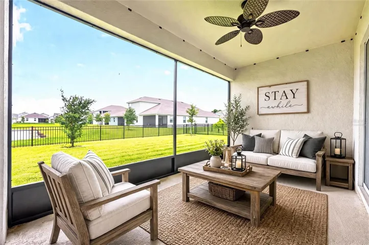 The screened lanai has pond views for the perfect indoor/outdoor living experience. Virtually Staged.