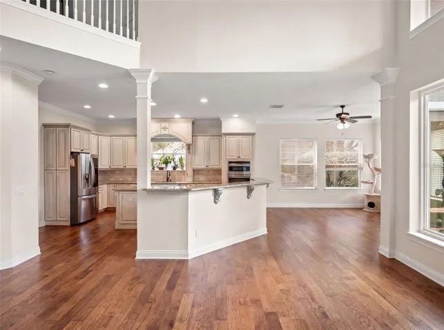 Family room looking into kitchen. Breakfast area to right of kitchen