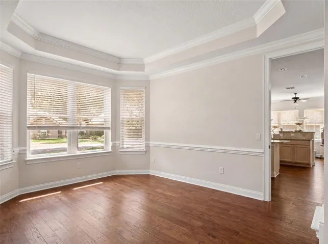 Formal dining room off kitchen with bay window