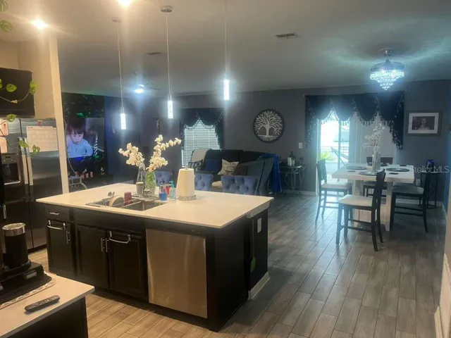 Open view kitchen with dining area and living room