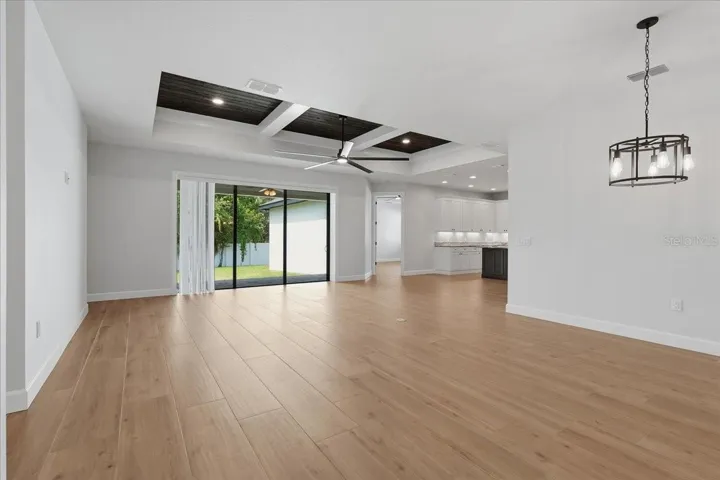 Entrance into dining area flowing into the living room