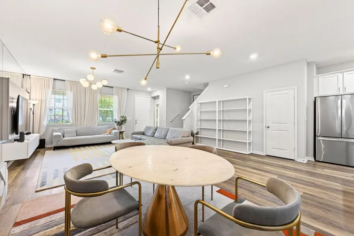 The inviting Dining area just off the Kitchen and adjacent to the Living Room, offers the perfect space for casual meals and everyday gatherings.