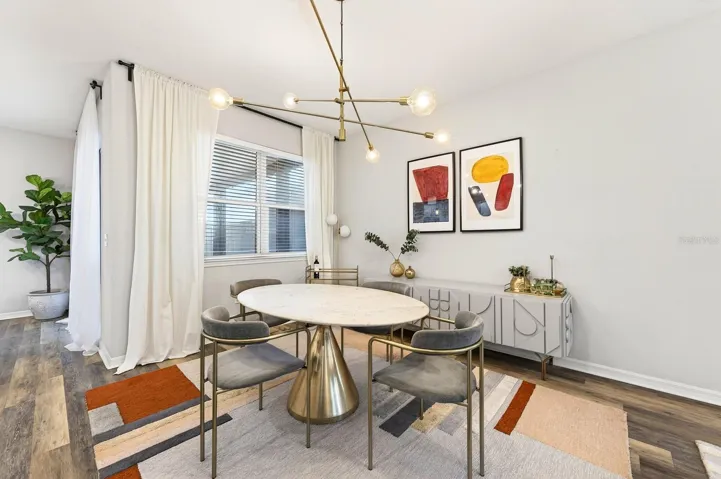 The inviting Dining area just off the Kitchen and adjacent to the Living Room, offers the perfect space for casual meals and everyday gatherings.
