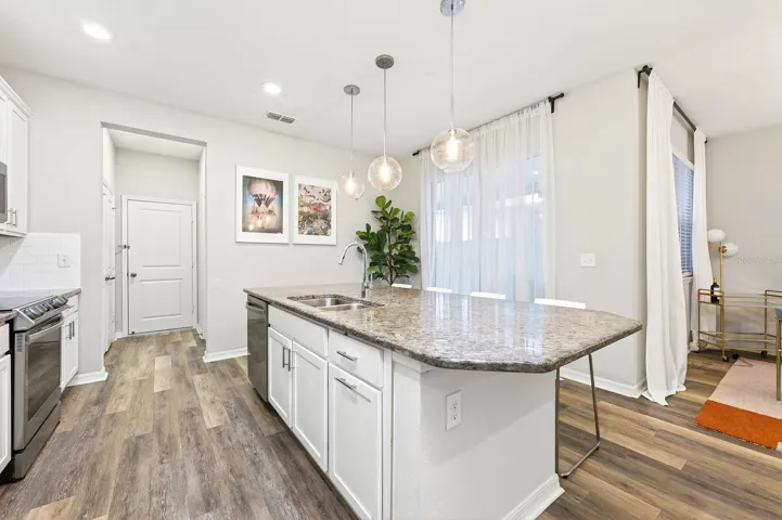 Sliding glass doors from the Living area open to a COVERED REAR PATIO.